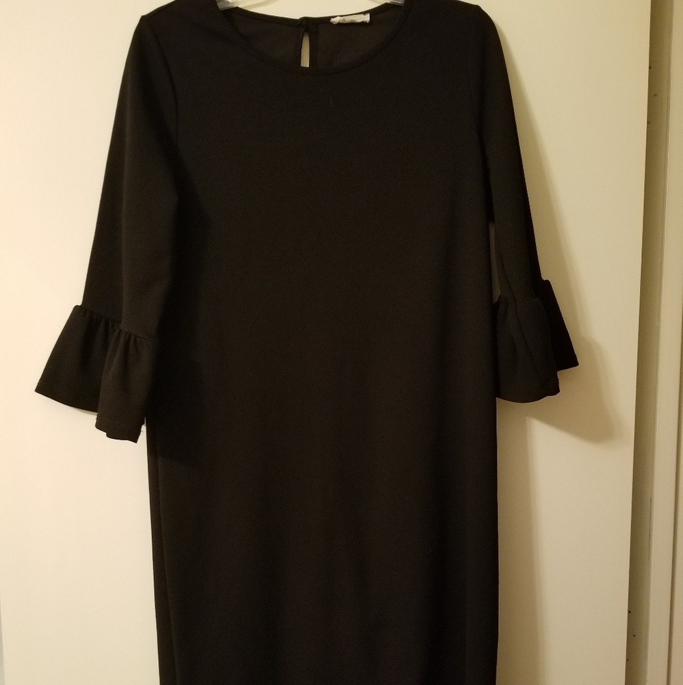 New. Cute black dress with bell sleeves